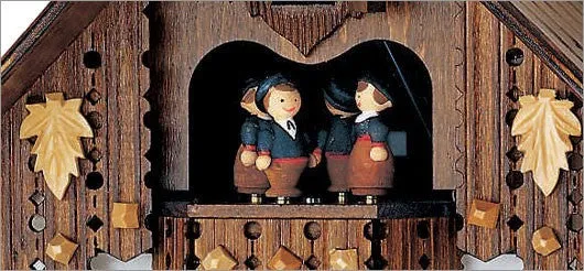 Black Forest Musical Wood Chopper with Green Shirt Cuckoo Clock